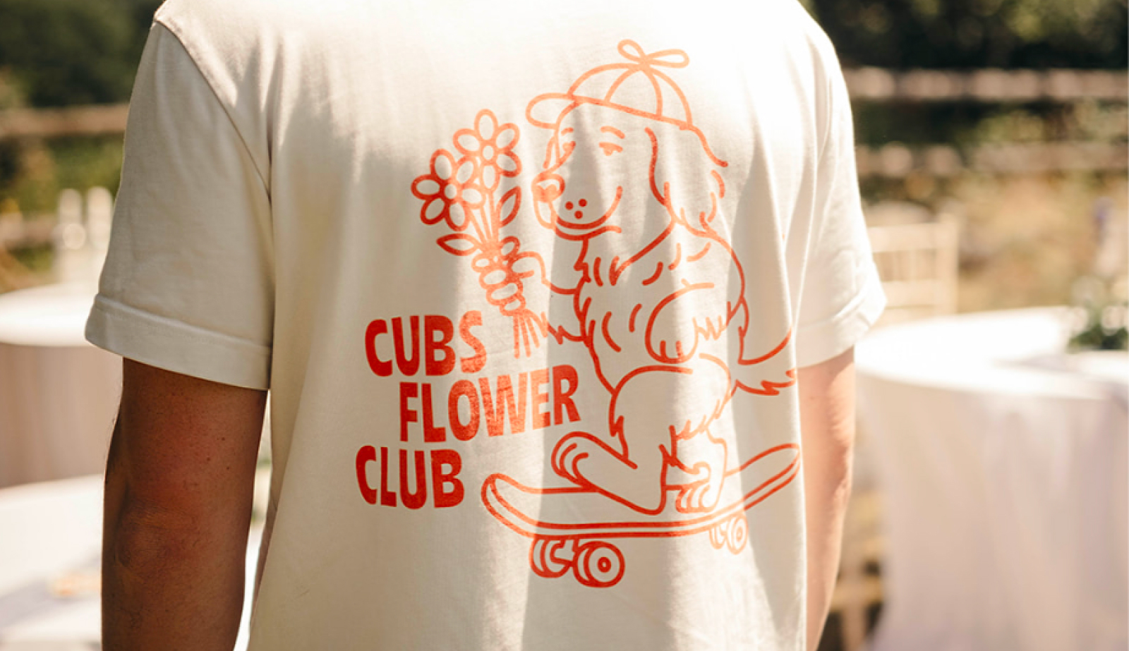 Branded clothing in Grimsby - cream tee with the Cubs Flower Club illustration print